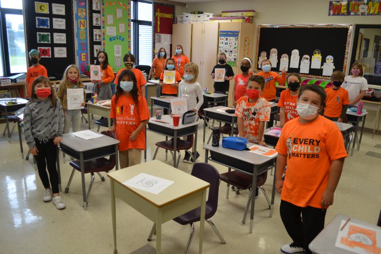 students wearing orange