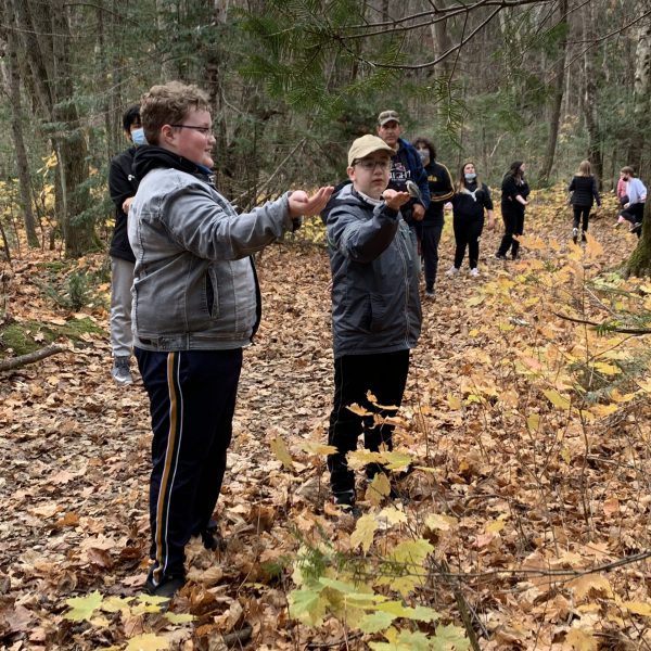 students hand feeding birds