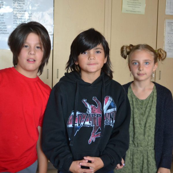 three students on day one of school