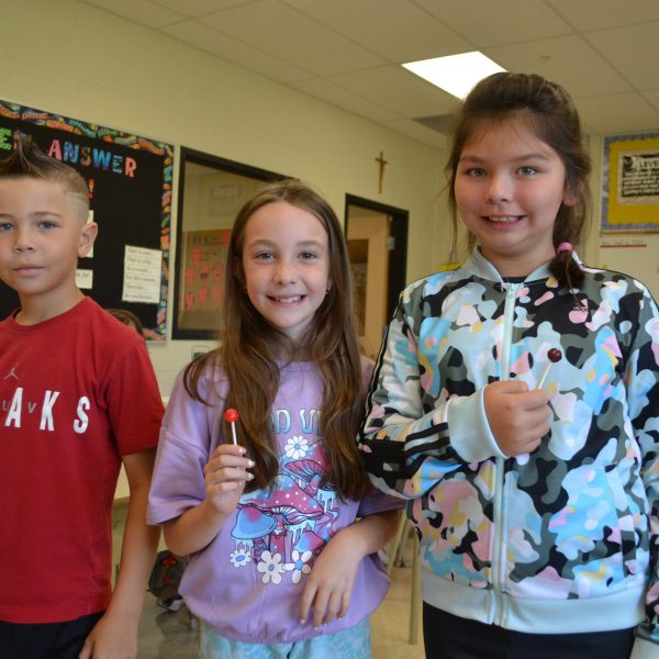 two female and one male student in classroom
