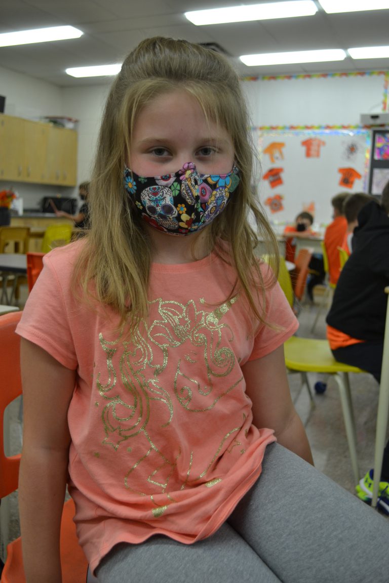 student wearing orange