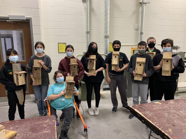 students show their birdhouses