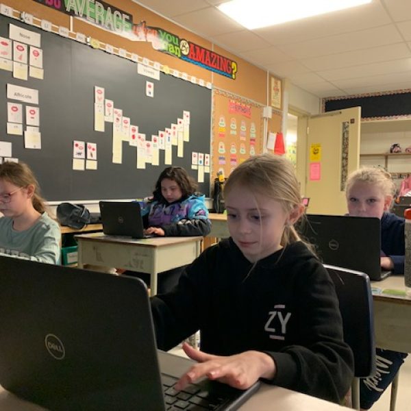 Students working with computers in classroom