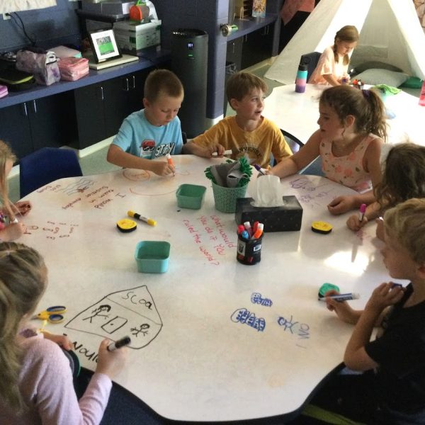 A group of students work at a table