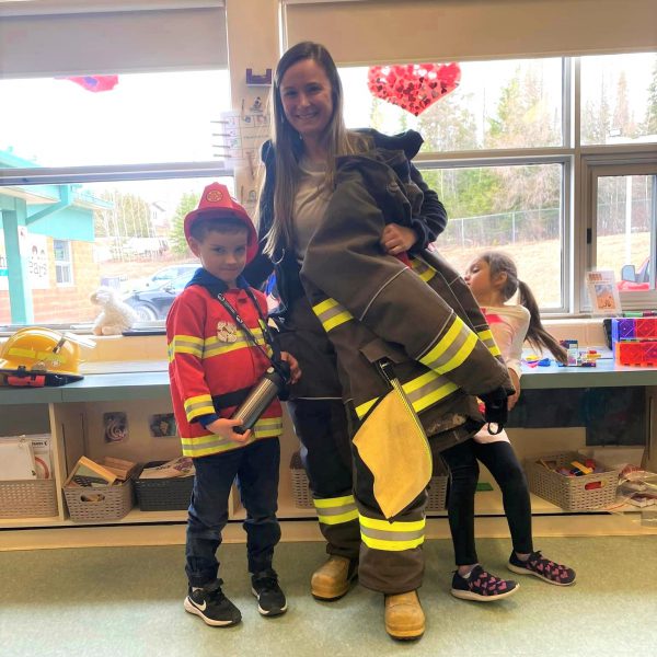 Firefighter parent with children on career day