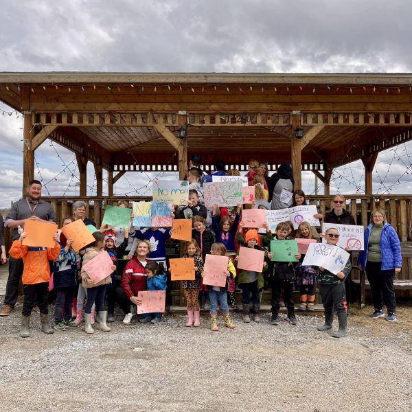 Group shop of students holding signs after the Walk for Justice