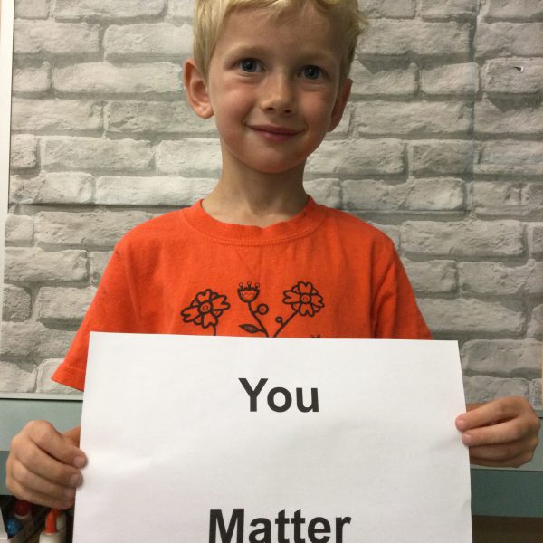 student holds you matter poster