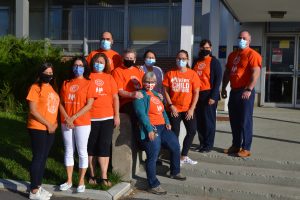 employees wearing orange