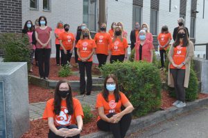 staff wearing orange