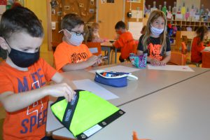 orange at the desk