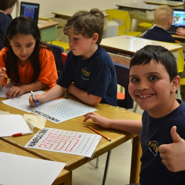 Student gives the thumbs up sign