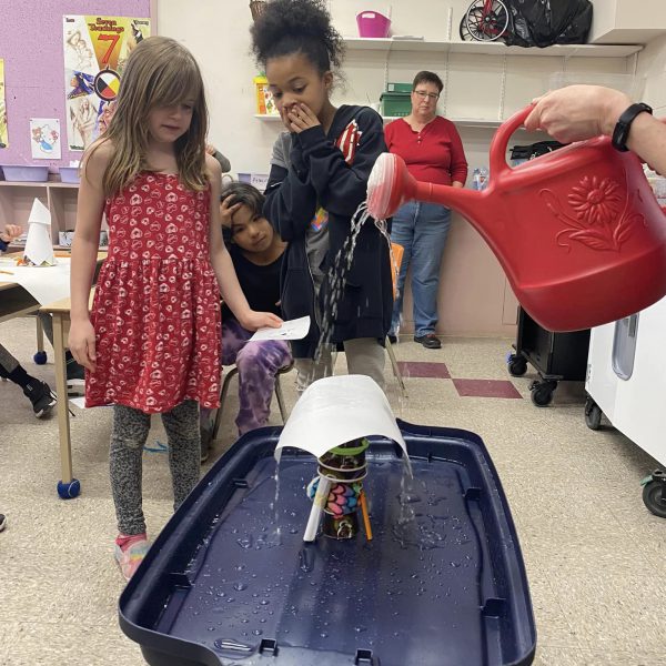 Students perform an experiment in class