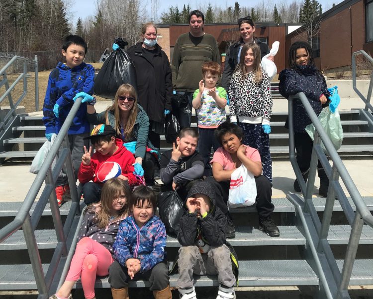 students post after trash collection during Our Lady of Fatima's Walk for Justice