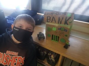 student showing his leprechaun trap