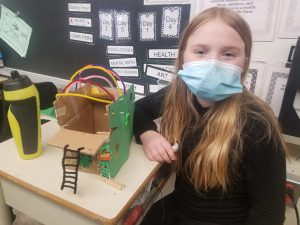 student with leprechaun trap