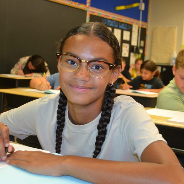 female student smiles for the camera