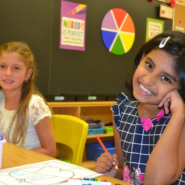 two females students smiling