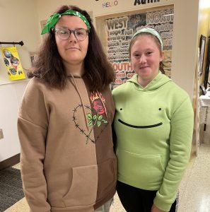 Two students wearing green to recognize Franco Ontarien Day