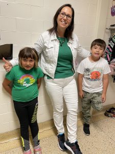 staff member with two students