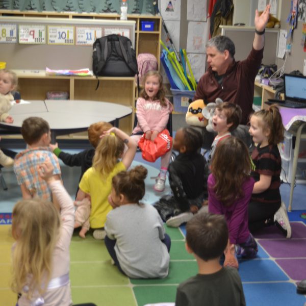 Kindergarten teacher with students