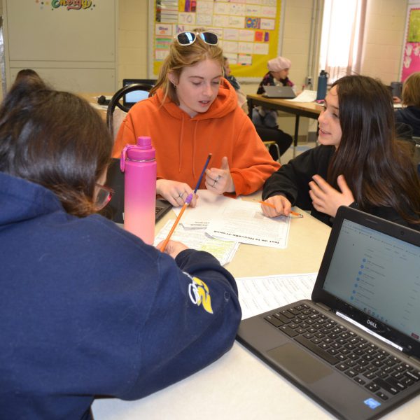 Students work together on an assignment