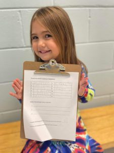 female student shows French words challenge