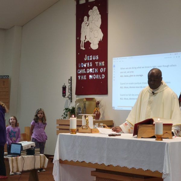 Priest leads Mass at St. Monica church