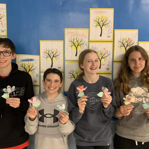 Students show off flower they created