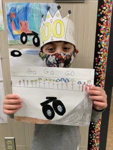 student showing artwork