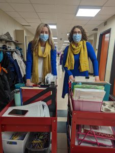 staff members in blue with yellow scarves