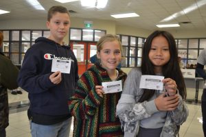 Students show their voter identification slip