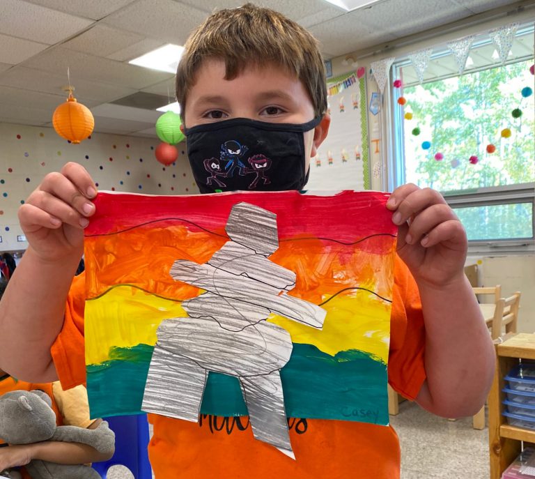 student showing art