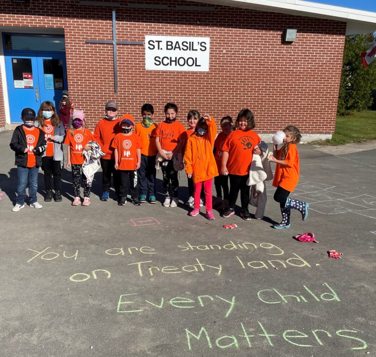 students in front of school