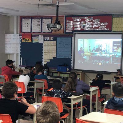 students watching virtual presentation