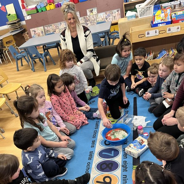 Kindergarten students gathered in a circle for an activity