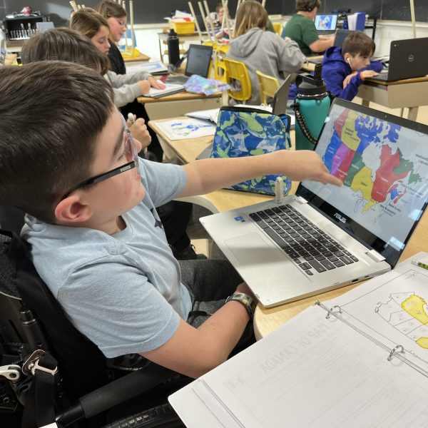 Student in a wheelchair works on a computer