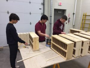 The varnish team prepares first coat