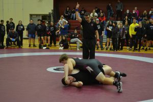 Male SMC wrestler gets upper hand on opponent