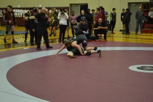SMC wreslter on top of opponent