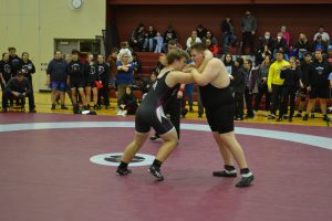 male SMC wrestler in cinch with opponent