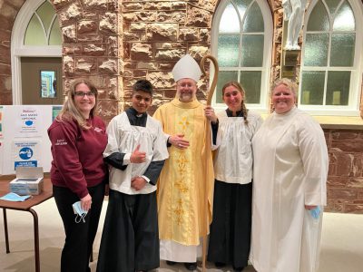 Students and Ms Parniak with Bishop Dowd