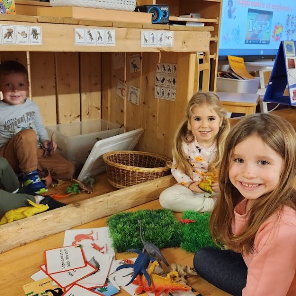 Kindergarten students smile for the camera