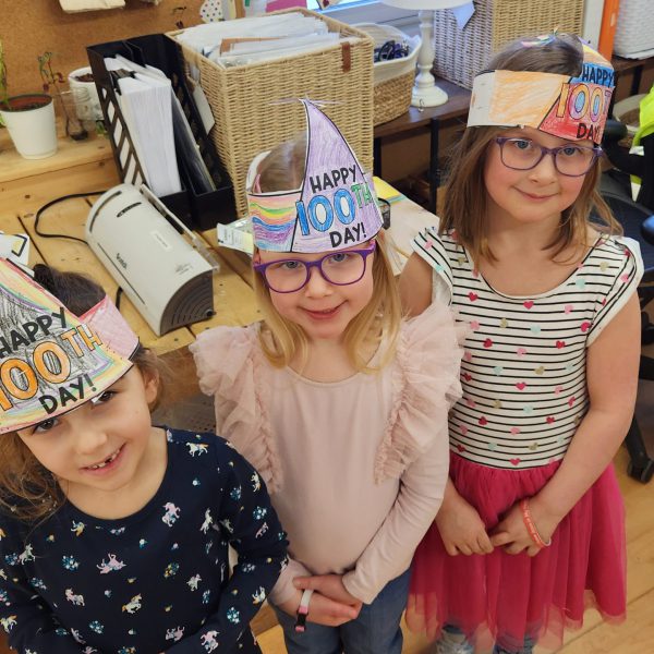 Three girls with their 100th day of school hats