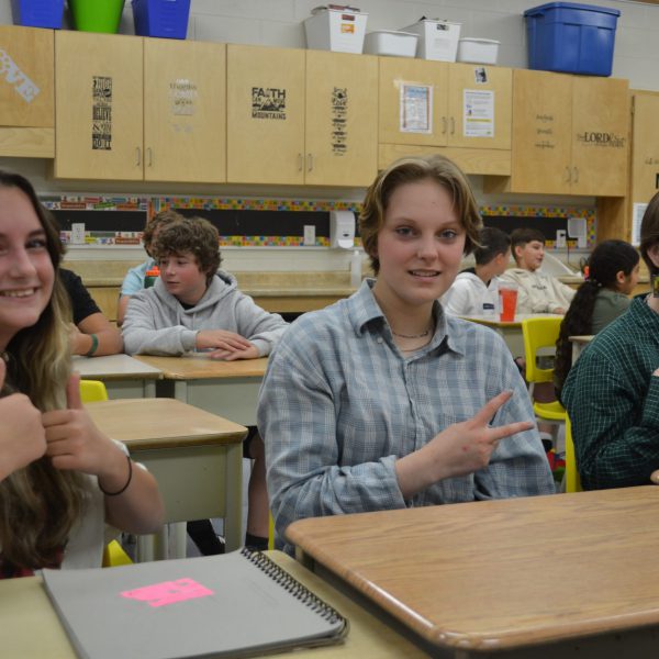 three students at desks