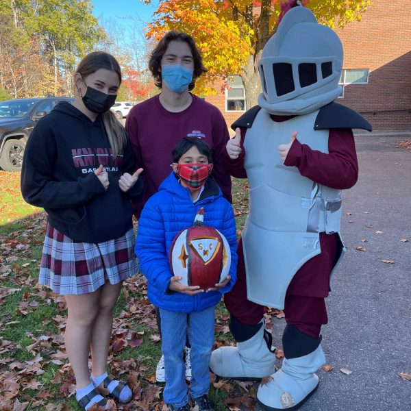 St. Paul student with SMC mascot