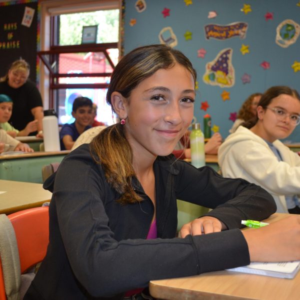 female student smiles at camera