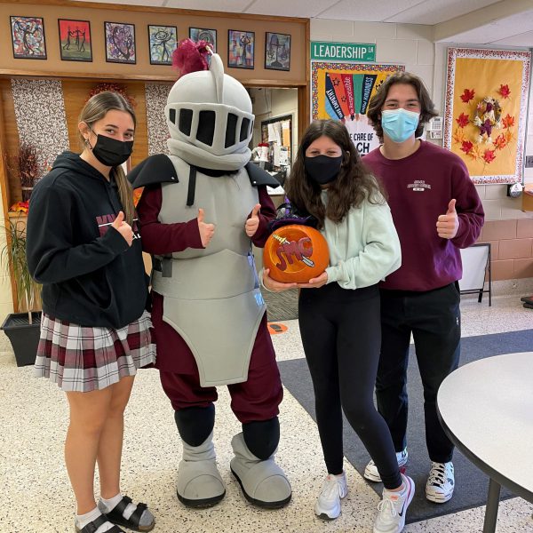 student winner with SMC mascot