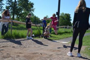 student soars in long jump