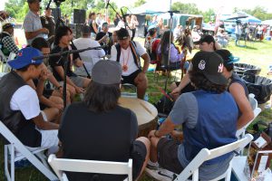 Drummers in the midst of a song at the Indigenous Day Pow Wow