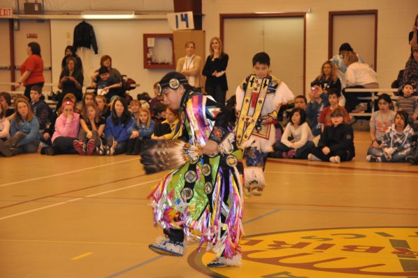 Indigenous person performing traditional dance
